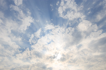 Fototapeta premium blue sky with sunbeams and clouds. Sun rays.