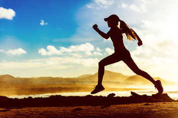 Silhouette athlete runner running in sunset