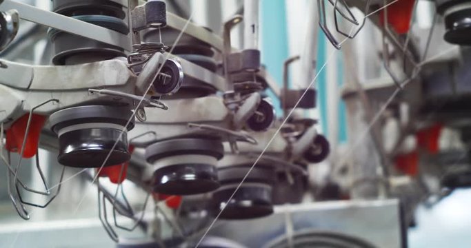 Industrial knitting machine producing cotton yarn