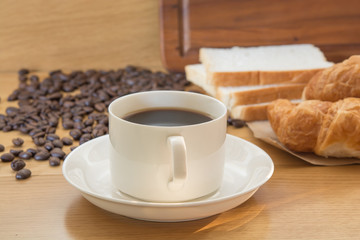 coffee and bread in the morning on food table