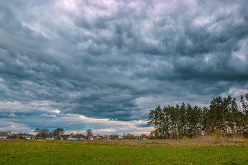 storm clouds moving over the field