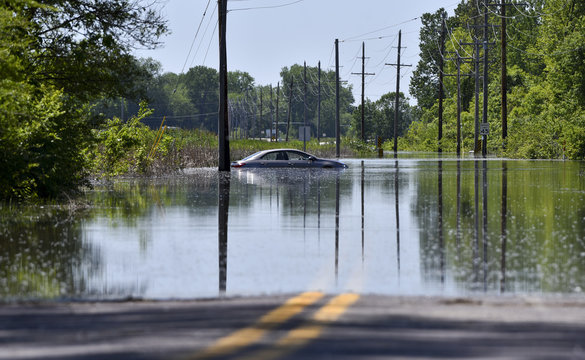 Stranded car on a flooded road