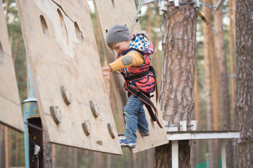 Gomel, Belarus - 30 April, 2017: Rope town for a family holiday in the countryside. Family competition to overcome aerial obstacles.