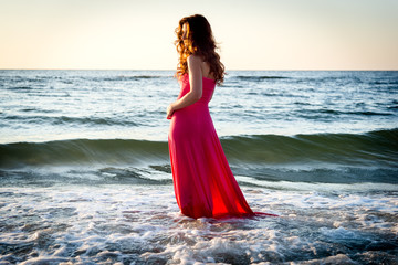 Fototapeta na wymiar Woman standing on the sea