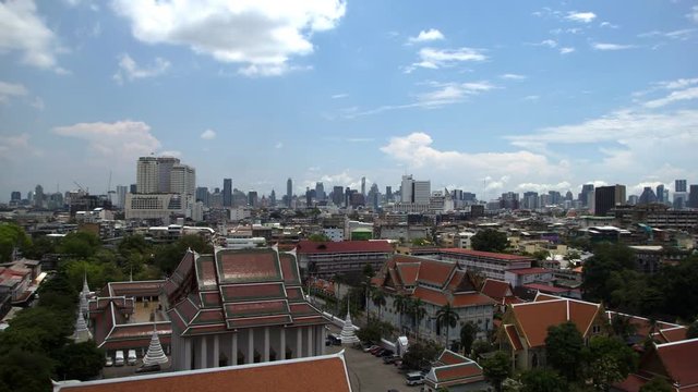 Clouds loop above Bangkok city skyline