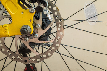 Obraz premium bicycle disk break installed on back wheel of yellow frame