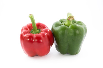 Red and green capsicum or sweet pepper isolated on white background