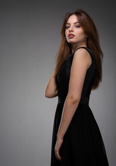 Fototapeta premium Teenage girl in black dress