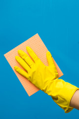 Hand with rag wipes window