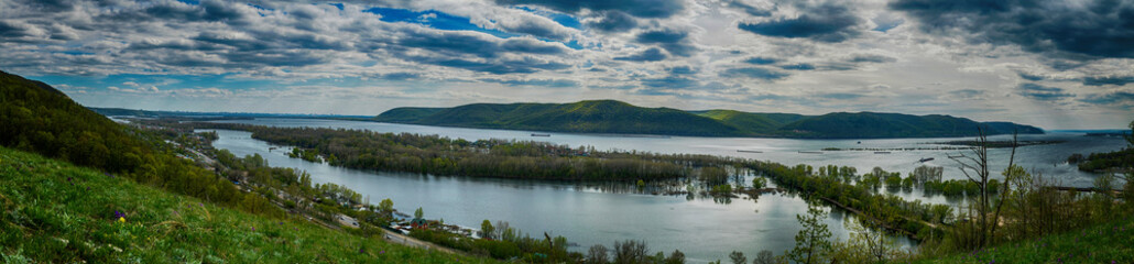 Naklejka na ściany i meble Panoramic view on Volga river and Zhigulevskie mountains in spring near Samara city, Russia 