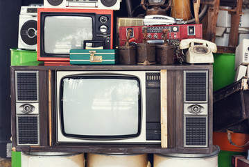 Pattern wall of pile black and white retro television (TV) - vintage filter effect style.