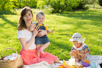 Young woman in the park with children