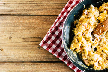 Scrambled Eggs on wooden background