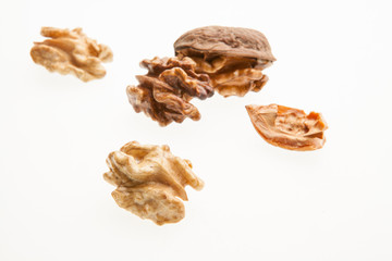 Walnuts on a white background.