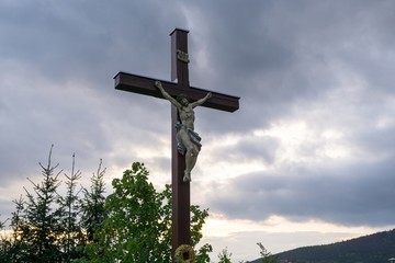 Cross with Christ during sunset. Slovakia
