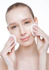 Beauty girl holding make up round puffs clean skin