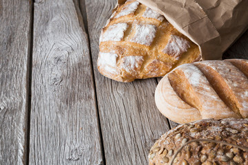 Bread background on rustic wood