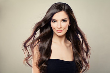 Naklejka premium Young Hispanic Fashion Model Woman with Brown Blowing Hair and Perfect Makeup