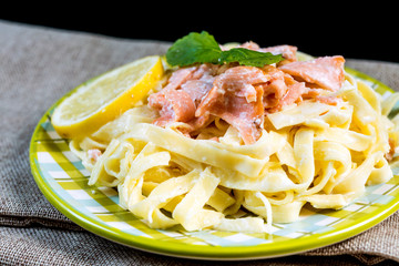 tasty pasta with salmon on a the table