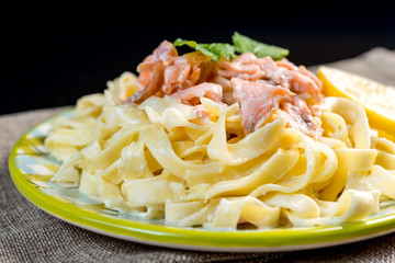 tasty pasta with salmon on a the table