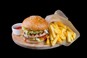 Burger with french fries isolated on a black background