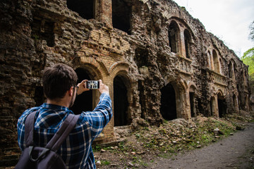 tourist taking picture of ruins