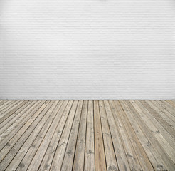 White brick wall and wood floor.