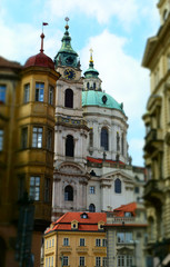 Fototapeta na wymiar The Church of Saint Nicholas: a Late-Gothic and Baroque cathedral in the Old Town of Prague in Czech Republic. Tilt-shift effect applied.
