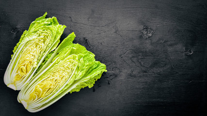 fresh chinese cabbage on wooden table. Top view.