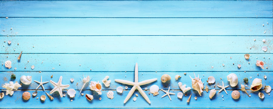 Starfish And Seashell On Blue Plank