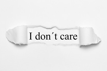 I don´t care on white torn paper