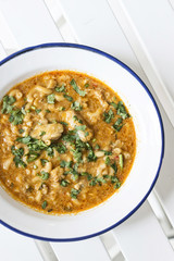 creamy spicy seafood fish soup with coriander