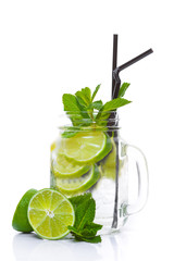 Cocktail with mint, lime and tonic. On a white background. Top view.