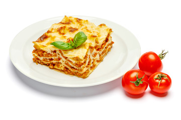 Portion of tasty lasagna isolated on white