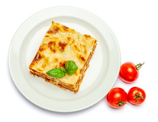 Portion of tasty lasagna isolated on white