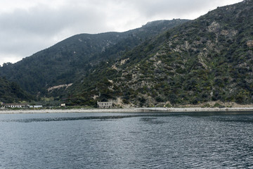 Beautiful coastline with mountains and rocks in Greece, photographed from the sea 