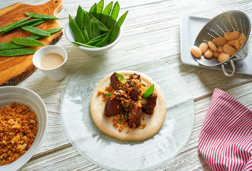  iberico pig cheeks pork meat with mangetout sugar snap peas