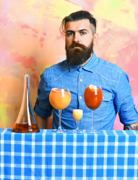 Brutal caucasian hipster with alcoholic cocktails and bar stuff