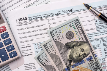 2017 tax from 1040  with dollar and calculator