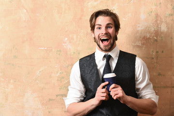 morning coffee, young happy business man holding paper cup