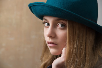 girl in retro green hat and blonde hair