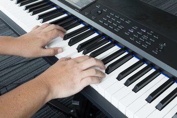 Fototapeta na wymiar Musician playing electronic piano