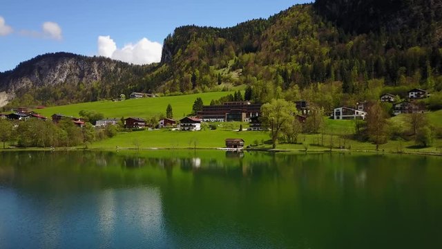Aerial view of lake thiersee tirol Austria in 4K - flying above water surface