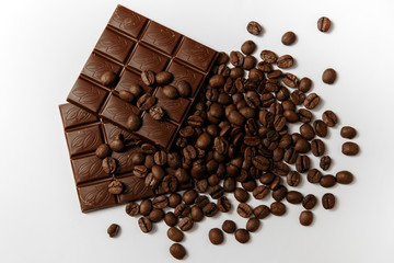 Chocolate and coffee on a white background. Top view.