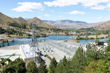 power transmission station near river in summer day