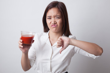 Asian woman thumbs down  hate tomato juice.