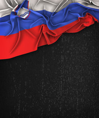 Slovenia Flag Vintage on a Grunge Black Chalkboard With Space For Text