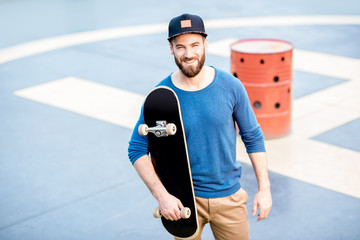 Portrait of a man with skateboard