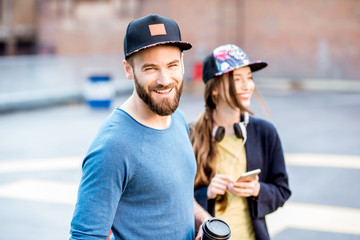 Portrait of a stylish man and woman outdoors