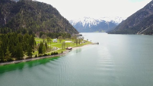 Aerial: Achensee lake at tirol in Austrian Alps with cloud reflections on water 